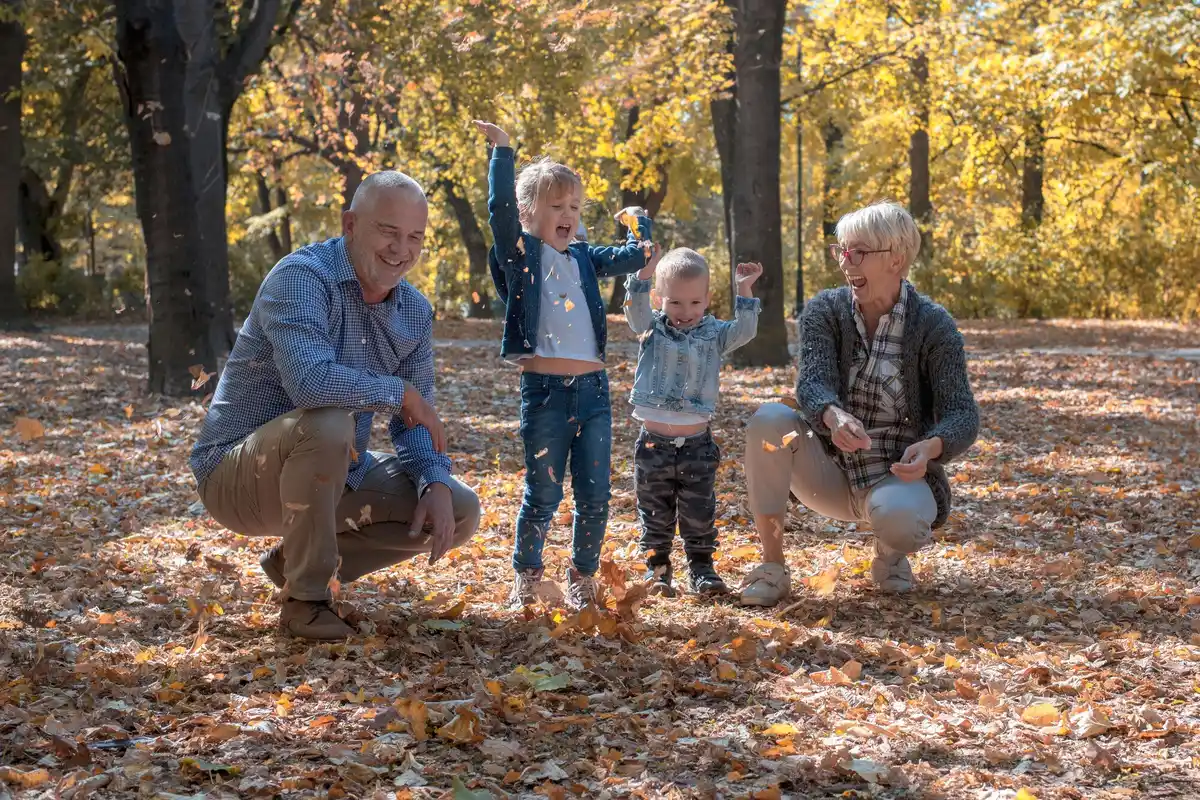 Seniors planning hiking route with paper map in Dutch nature