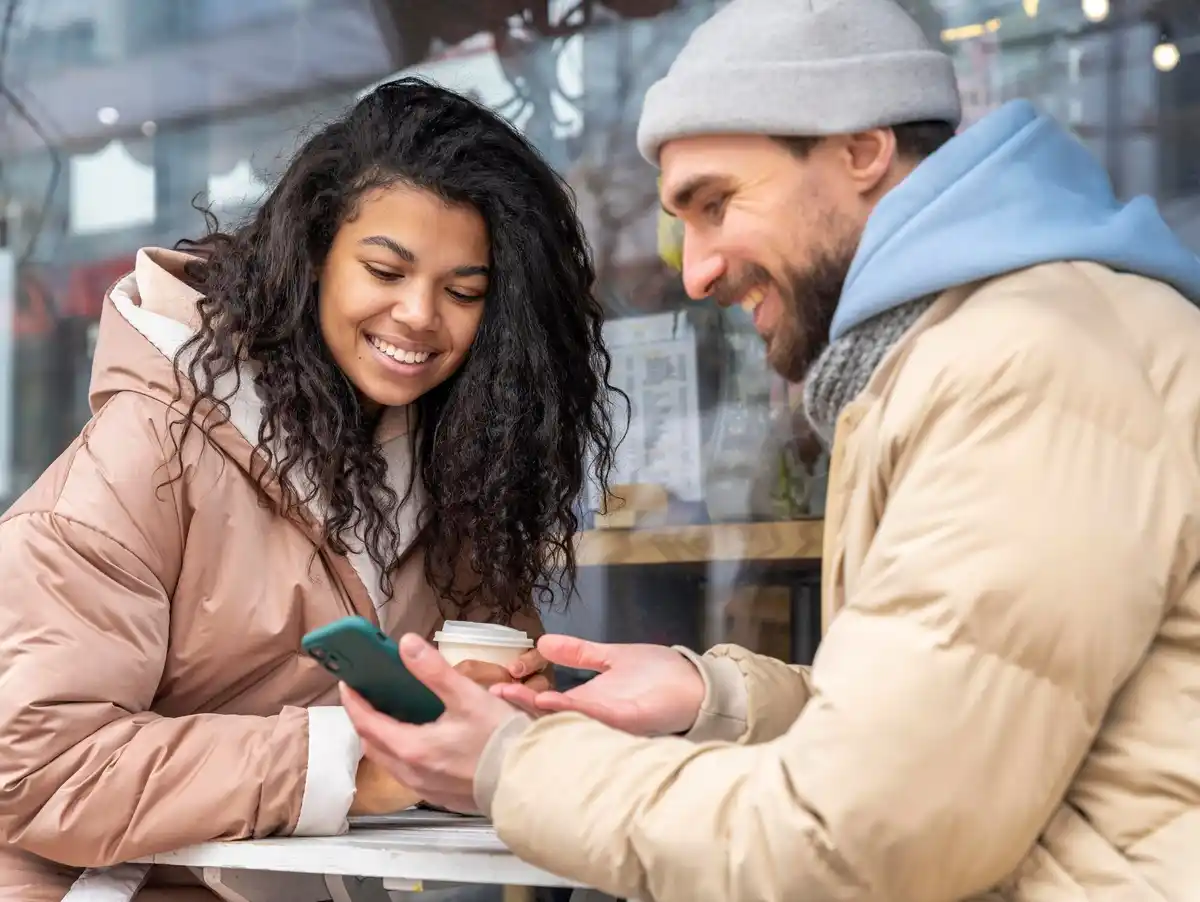 Dutch cafe people paying mobile phone