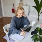 motivated adult student studying at home happy
