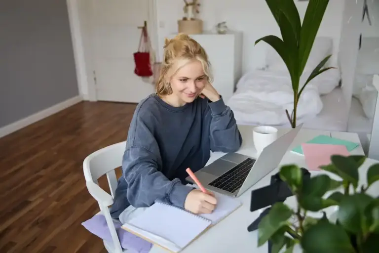 motivated adult student studying at home happy