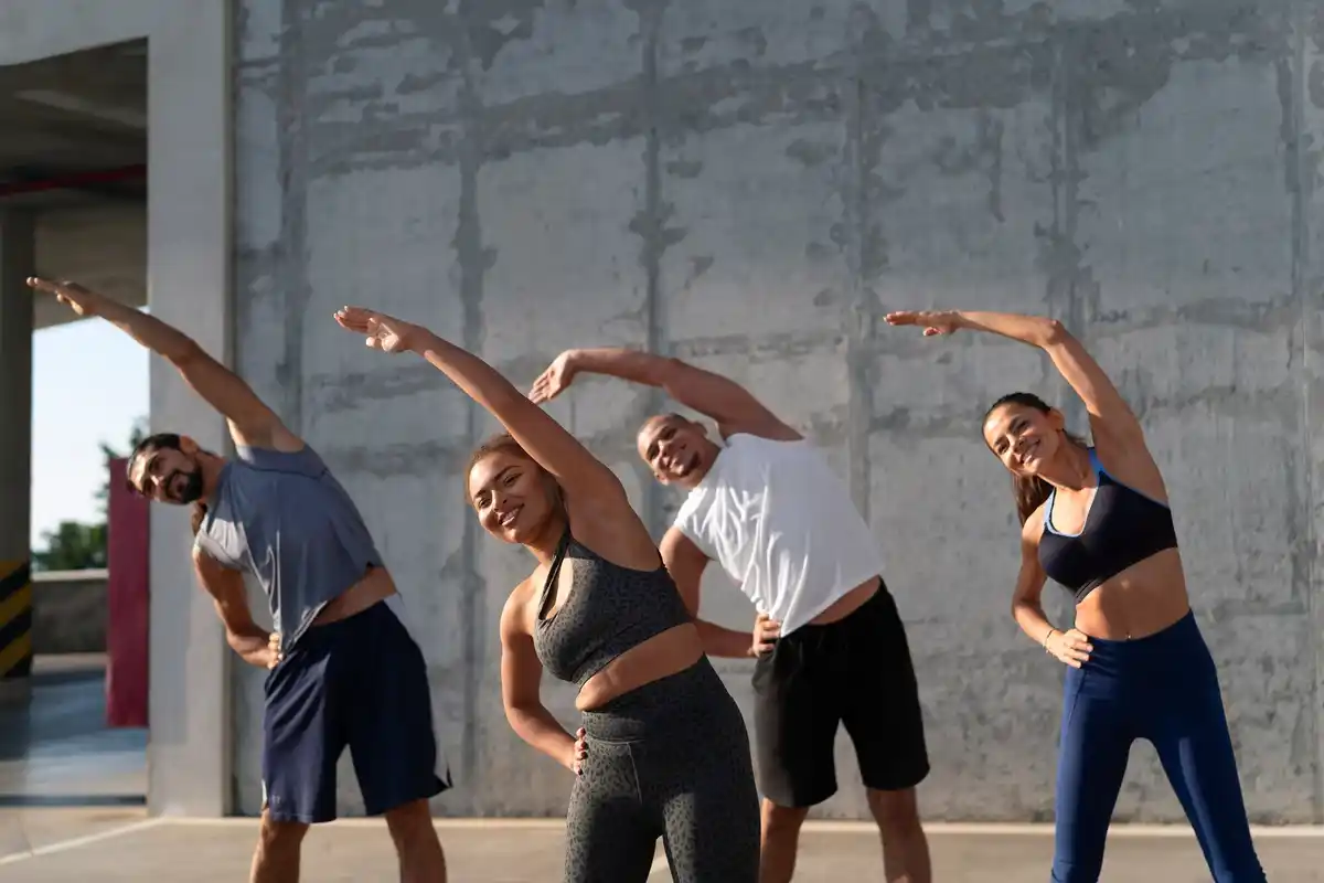 group fitness 40s Dutch park outdoor laughing real people
