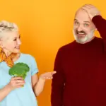 senior dutch couple surprised by high price shopping groceries