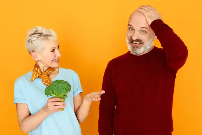 senior dutch couple surprised by high price shopping groceries