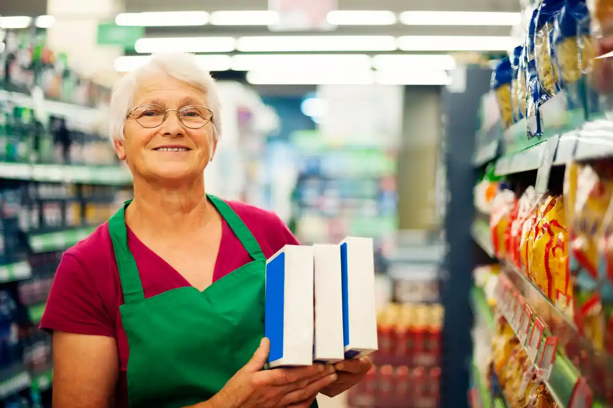 Dutch senior citizens shopping at a local market, noticing high prices