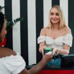 smiling hotel guest receives free room upgrade at check-in