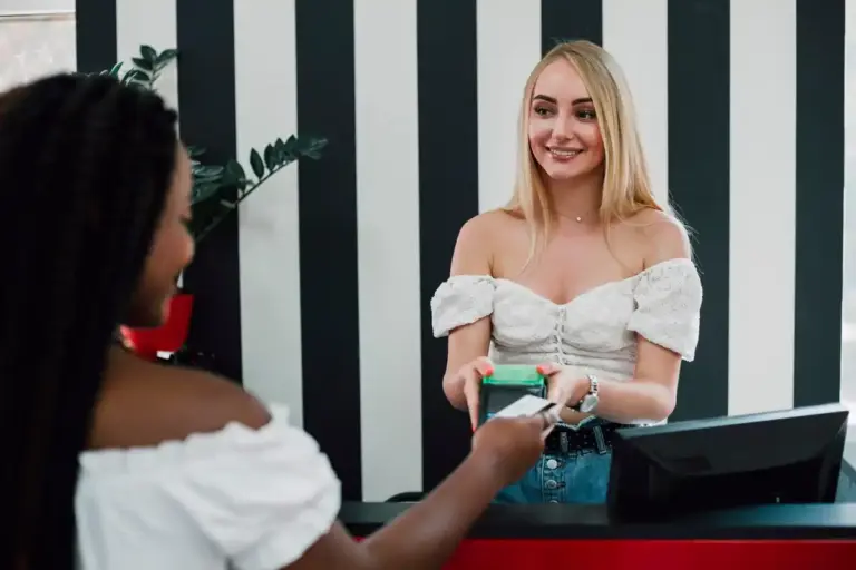 smiling hotel guest receives free room upgrade at check-in