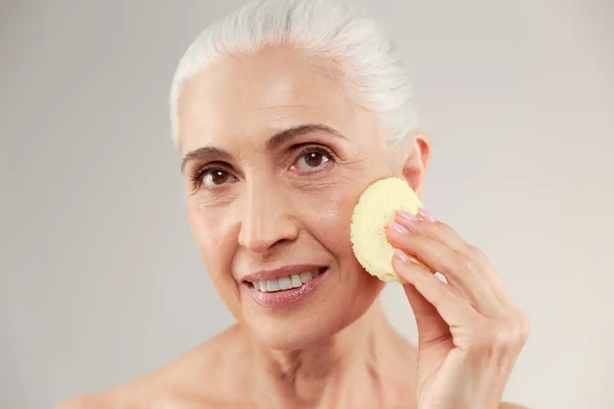 gentle makeup removal closeup mature woman