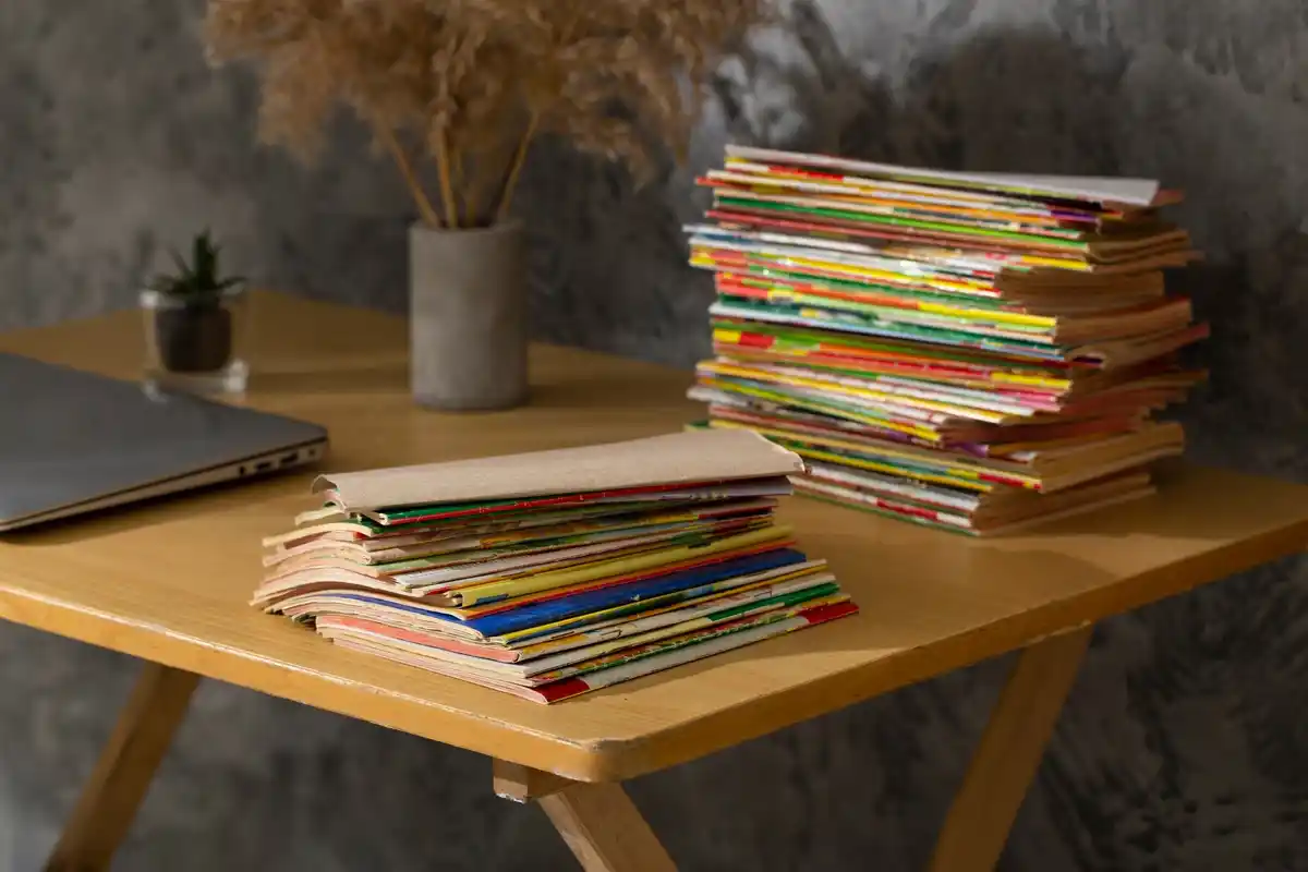 pile of old Dutch schoolbooks on a vintage wooden table