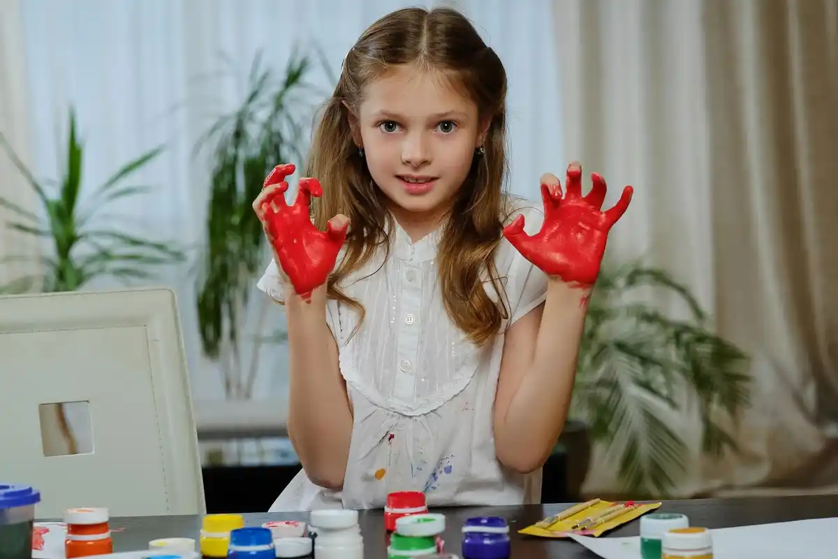 children making DIY art project with old textbooks