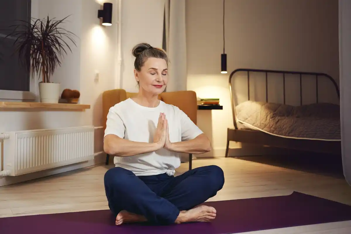 authentic dutch person practicing breathing yoga in cozy living room
