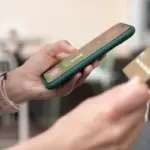 hand entering secret code smartphone dutch
