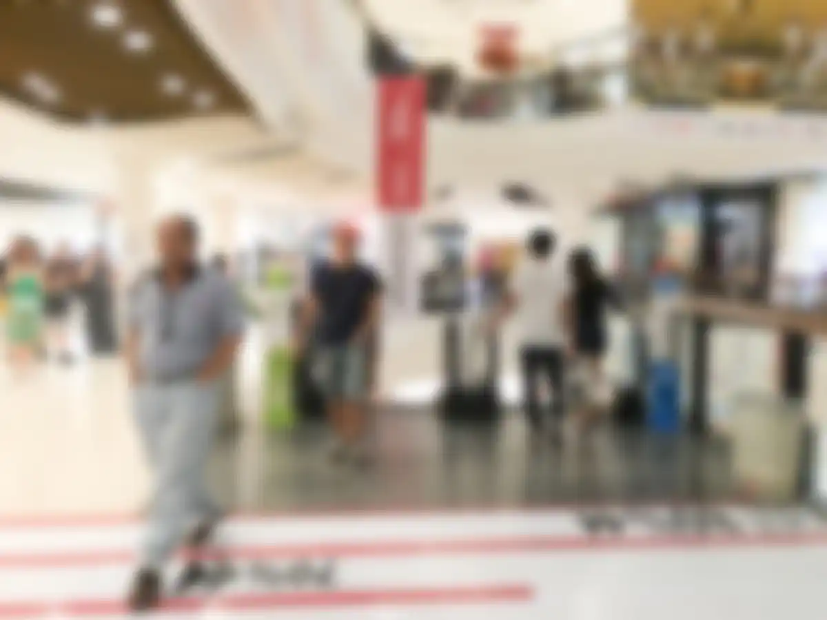 crowded airport check-in line stress