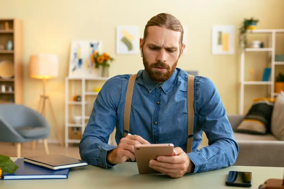 Dutch man thinking about online shopping decision