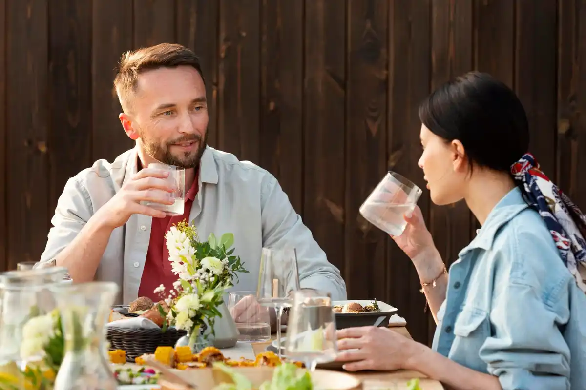 Dutch family eating together water glasses