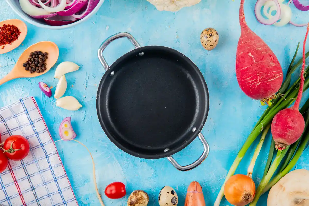 Dutch old frying pan with kitchen tools for no-stick cooking